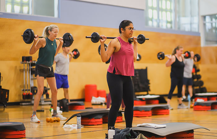 A group weight lifting & cardio class at Magnuson Athletic Club